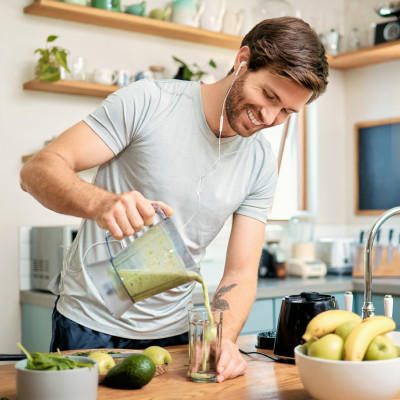 Man pouring smoothie